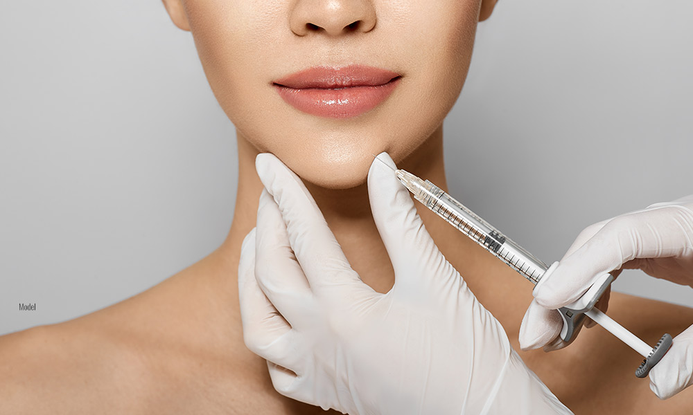 Women getting an injection in her chin